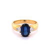 2.32 Carat Oval Cut Blue Sapphire with Trillion Cut Diamond Side stones in 18k Yellow Gold Ring