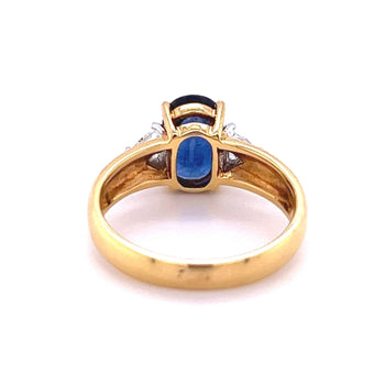 2.32 Carat Oval Cut Blue Sapphire with Trillion Cut Diamond Side stones in 18k Yellow Gold Ring – Assay Jewelers