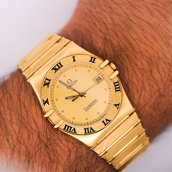 Omega Constellation Manhattan 18K Gold Roman Numeral Bezel Champagne Dial Watch – Assay Jewelers