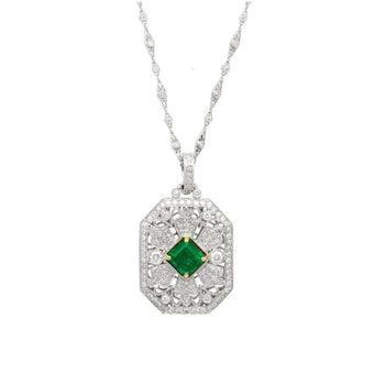 Vintage Carved Platinum 3.16 Carat Vivid Green Minor Oil Emerald Pendant with 4 CTTW in Diamonds – Assay Jewelers